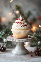 Delicious vanilla cupcake with frosting and red berries, set in a charming holiday background with pine and seasonal decor.