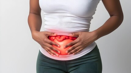 Woman massaging lower abdomen to relieve cramps or digestive discomfort