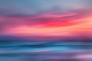 Naklejka premium A blurred image of a beautiful sunset over the ocean with warm colors