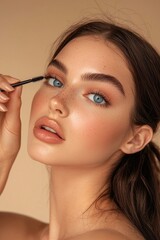 Fototapeta premium Woman Enhancing Her Eyes with Mascara