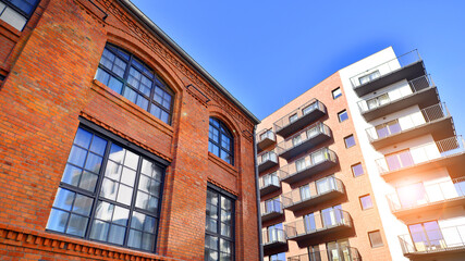 Fototapeta premium Modern multifamily building in a european city. Walls made of concrete. Luxury house complex.