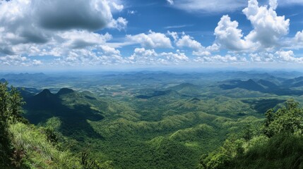 Obraz premium Panoramic view from Phu Ruea National Park, showcasing the vast green mountains and