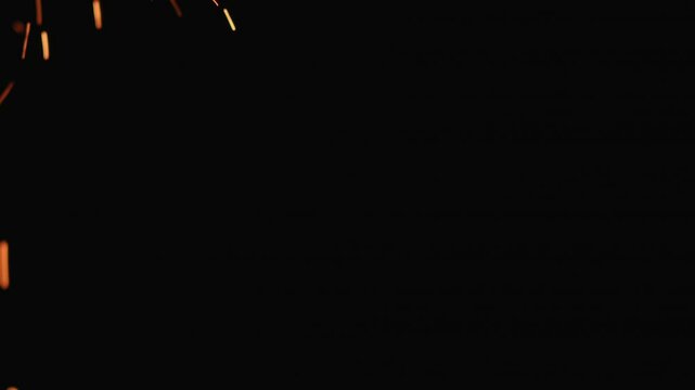 Slow motion hot sparks falling from above black background, 180fps