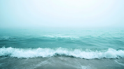 Fototapeta premium Serene Ocean Waves on a Misty Morning, sea, beach, shore, coastline, water