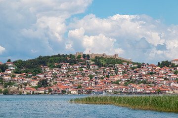 Scenic view of charming lakeside town nestled on shores of Lake Ohrid, North Macedonia. Majestic...