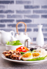 fresh breakfast, boiled eggs with rice meat and vegetables