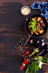 Baked eggplant sticks glazed with sauce, delicious vegan chinese dish.