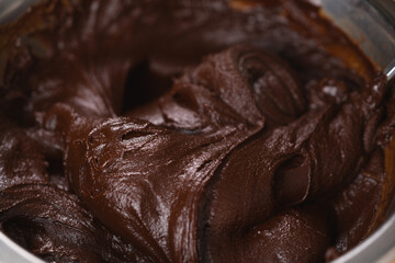 mixing cream into melted chocolate