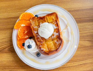 honey toast with cream, orange, berry and homemade ice cream
