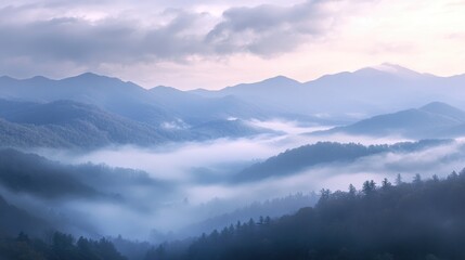 The mountains are covered in fog and the sky is a mix of blue and white. The scene is peaceful and serene, with the mist adding a sense of mystery to the landscape