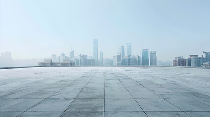 Fototapeta premium This image depicts a large, empty concrete surface extending towards a distant, hazy city skyline under a light blue sky The perspective and horizon line create a sense of openness, with the empty 