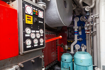 The engine room of a ship with electric motors and mechanisms.