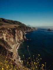 Foggy Big Sur coastline with ocean and rolling hills. California landscape photography for design and print.