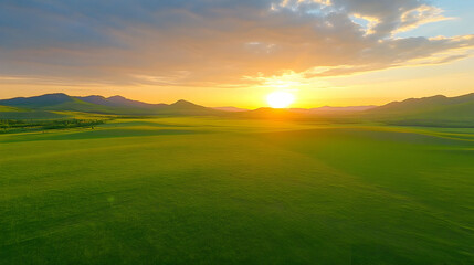 Naklejka premium Sunset Over Rolling Green Hills, sunrise, golden hour, horizon, sky, clouds