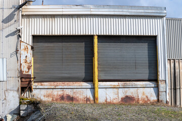 Garage doors in an old abandoned industrial plant