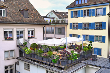 Naklejka premium Terrace with flowers and plants in Zurich Switzerland