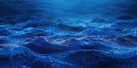 Blue ocean with a lot of white specks. The ocean is calm and peaceful. The white specks are like stars in the sky