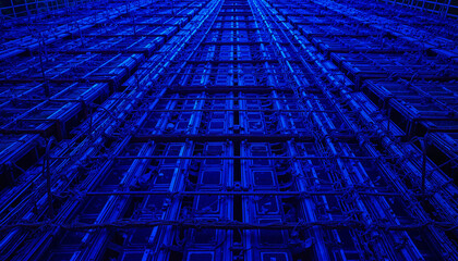 Obraz premium The captivating sight showcases a tall architectural structure bathed in shades of blue, highlighting its geometric patterns and electrical design elements under night lighting