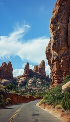 Naklejka premium Winding canyon road amidst stunning desert rock formations a call to adventure and exploration