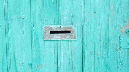 Mail Slot Rustic Door Close-Up Turquoise Weathered Wood Surface