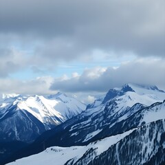 Breathtaking view of the snowy mountains under the cloudy sky