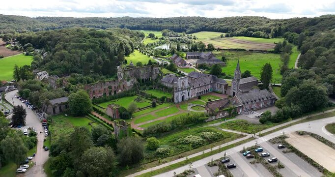 An aerial drone video of Ruins Abbey of Aulne at the Sambre , Gozee , Thuin, Belgium. Historic Monument heritage. Aerial overview. Touristic attraction in Belgian Ardennes.