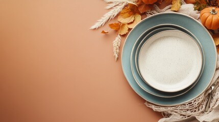 Elegant Autumn Table Setting with Plates and Decorative Elements