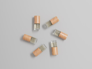 Small cylindrical liquid cosmetic bottles mockup, 1 ml empty labeled wood cap and clear glass bottles packaging isolated on clean background, short liquid tube containers, sample product bottle mockup
