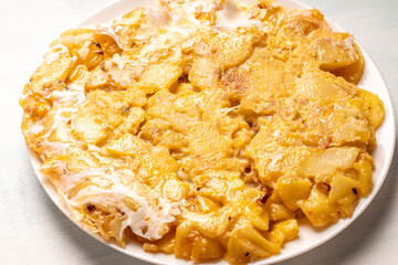 Spanish omelet or Tortilla de patatas, with potatoes and onion, typical Spanish cuisine.