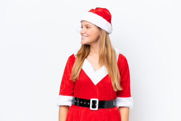 Young caucasian woman dressed as mama noel isolated on white background looking side