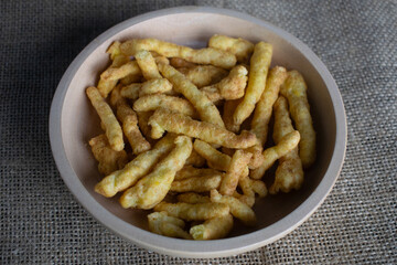 Corn chips snack in wooden bowl