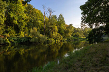 View of the Olza River at the beginning of autumn