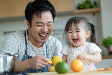 Fototapeta premium An Asian father with glasses and his laughing daughter enjoy breakfast prep in a minimalist kitchen. Warm smiles and light atmosphere highlight family bonding. **Concept: family moments**