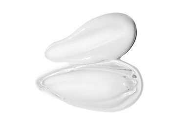 Composition of white cream smears and transparent gel smears on an empty background. Skincare...