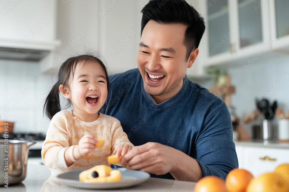 Wall mural a close-up of an asian father and daughter enjoying breakfast in a cozy kitchen, laughing together a