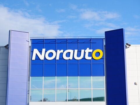 A tight shot of the name of a store "Norauto" in autumn. Reims, France - October 16, 2024