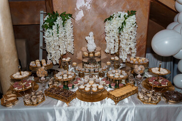 Elegant Dessert Table with Floral Accents for Celebratory Event