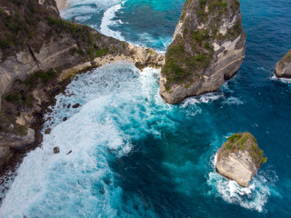 Stunning coastal cliffs and turquoise waters create a breathtaking seascape.