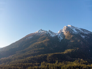 Snow-capped mountains under a clear blue sky.