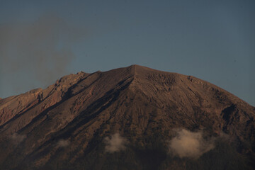 A majestic mountain peak under a clear sky.