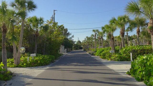 POV driving on Casey Key scenic road in sunny Florida.