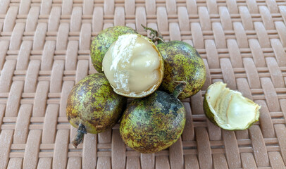 Selective focus on matoa fruit or Pometia pinnata. Matoa fruit is often found in Southeast Asia.