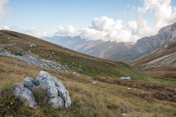 Picturesque evening view of Fisht-Oshten massif with grass-covered hills and boulders in the...