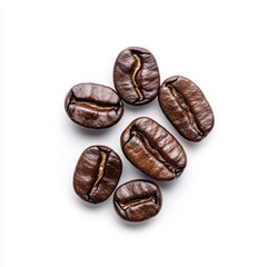 Obraz premium A close-up of six dark roasted coffee beans arranged on a white background, showcasing their rich texture and color.