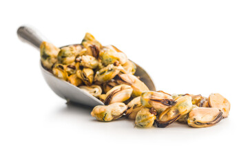 Shelled mussels meat in scoop isolated on white background.