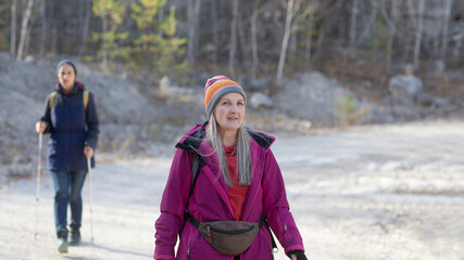 senior woman  with gray hair   walks in autumn outdoor. copy space. mental health. Slow life.  copy space