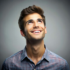 Obraz premium portrait of the young smiling thinking man looks