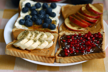 toast with chocolate peanut butter banana apple cinnamon blueberry and white cream cheese