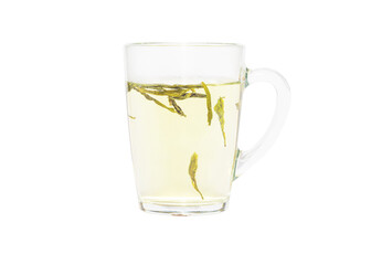 Water has just been added to a transparent cup with green tea leaves. Dragon Well green tea (Longjing tea). Isolated on a white background.