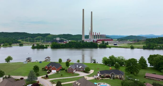 Residential neighborhood close to thermal power plant in Roane County near Kingston, Tennessee. Coal fossil fuel causing environmental pollution during electric energy production in American grid.